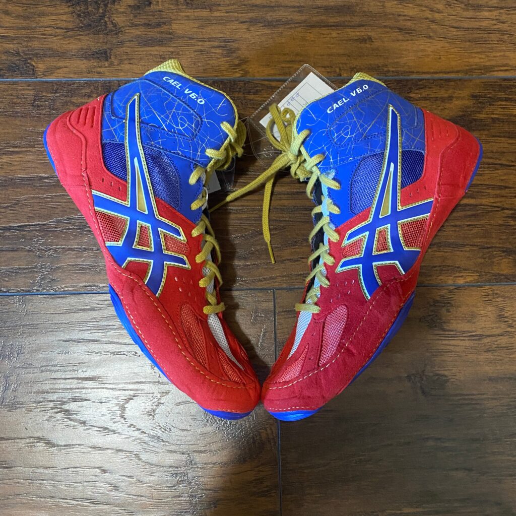 sample cael sanderson v6 wrestling shoes in blue red gold and white