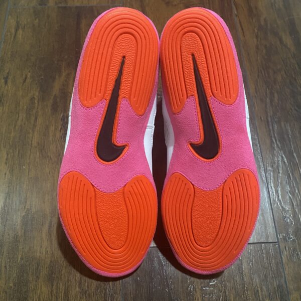 red and pink soles on nike inflicts