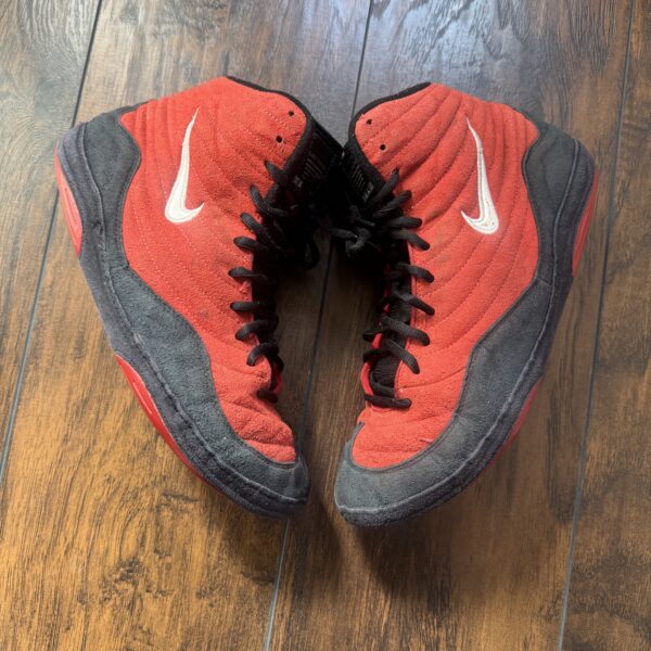 red and black nike og reissue inflicts